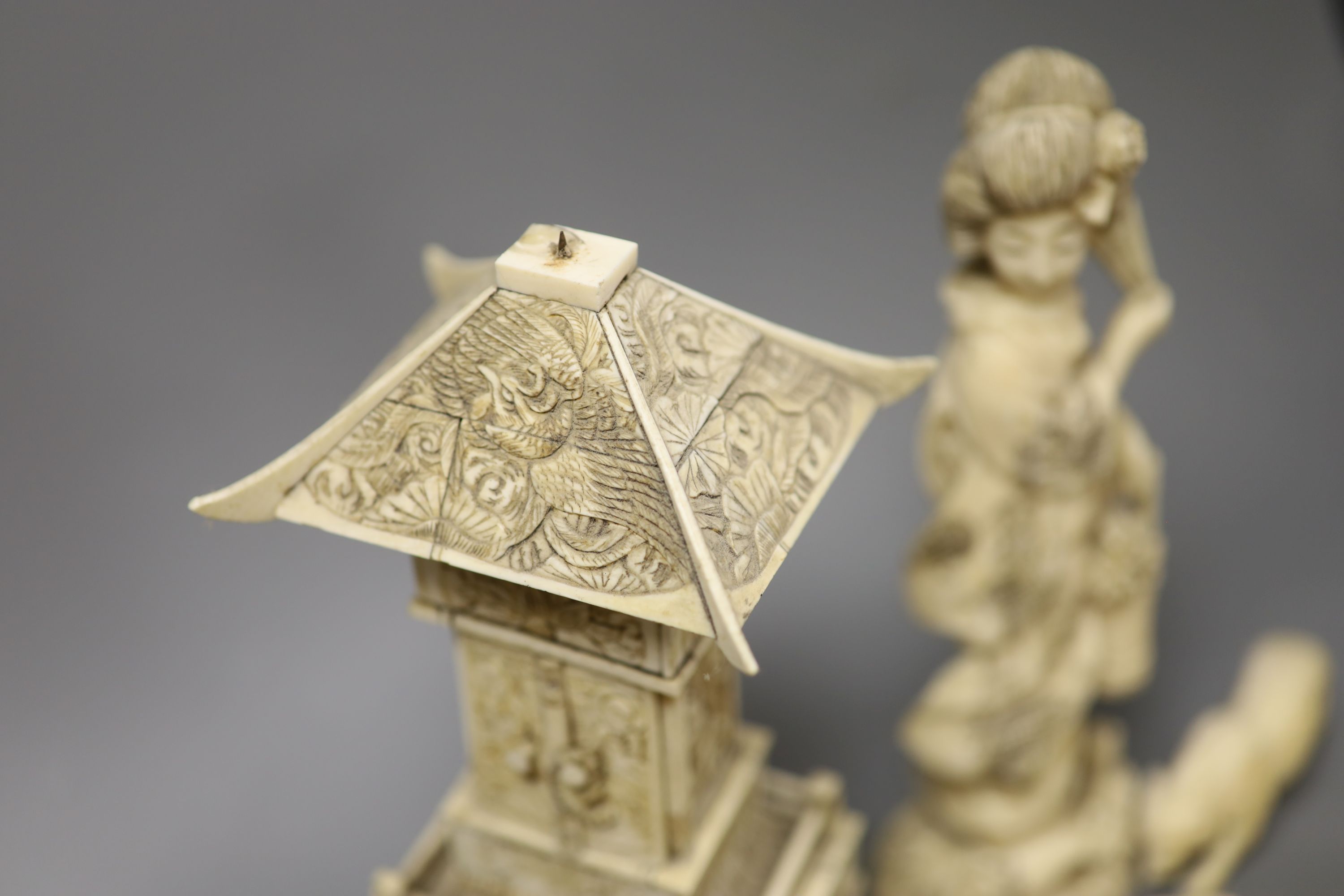 A Japanese Ivory model of a bijin, a similar model of a temple, various European Ivory models of animals and birds, an Indian Ivory figure et cetera, or late 19th or early 20th century